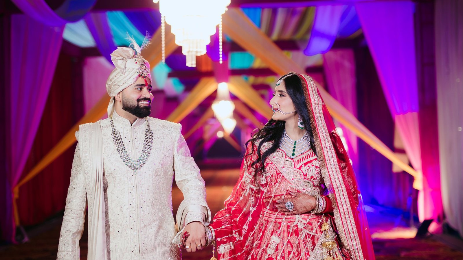 Groom in ivory sherwani with his bride, groom styling by THE HBM in Greater Noida